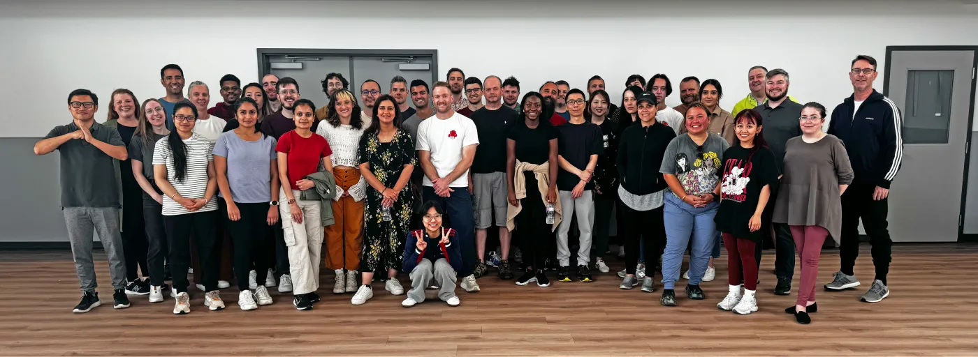 Group shot of the Punchcard Team participating in Tai Chi at Punchcard Connects 2024